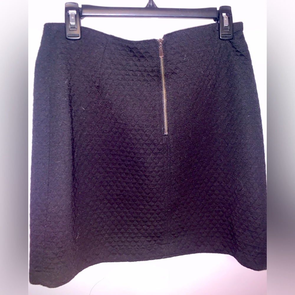 black pleated skirt